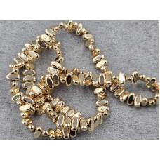 Гематит овал 3*6 мм товщ. 2,5 мм з поперечним отвором колір золото довжина 39-40 см