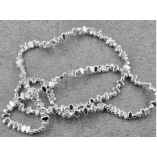 Гематит овал 2*4 мм товщ. 2 мм з поперечним отвором колір срібло довжина 39-40 см